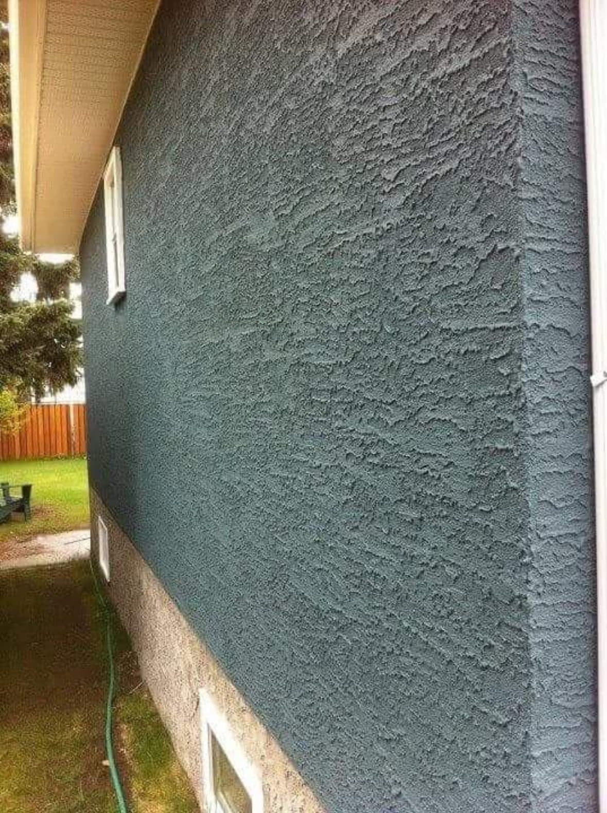 Close view of a heavy-texture acrylic stucco wall finished by First Class Stucco & Masonry